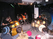 ﻿Von links: Herman Rarebell, Pete York und Chaly Antolini im wilden Trio beim Finale des 'Tag der offenen Tür' der 'Drum-Legend-School' von drummer's focus am 5.12.2004 auf der Bühne im df-München.